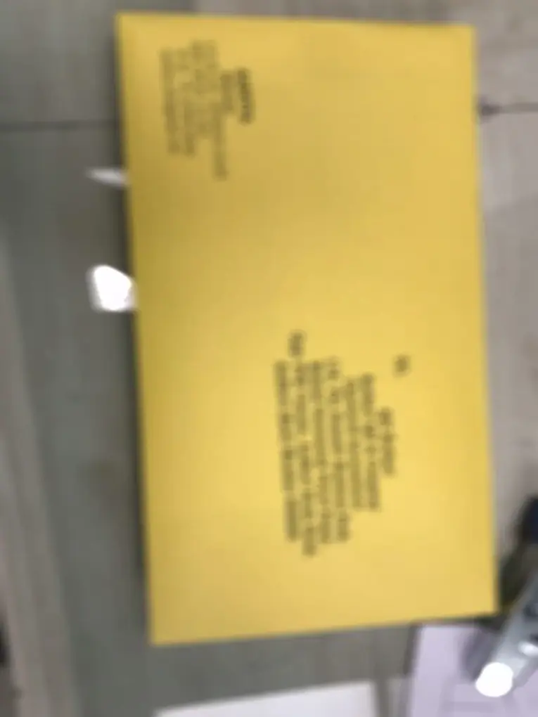 Legal notice dispatched in Speed Post yellow envelope — physical delivery with tracking ID